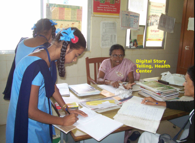 little Indian girls in blue dresses working on creating a story