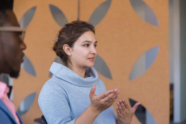 A girl making a hand gesture as if she is narrating a story